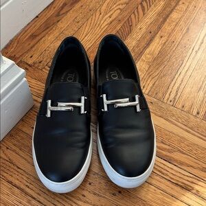 Tod's Black Leather Slip-On Loafers with Silver Accent